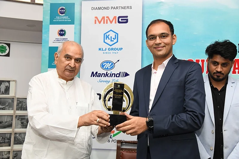 Karma ayurveda's founder: Dr Puneet Dhawan receiving award's from 