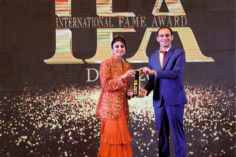 Karma ayurveda's founder: Dr Puneet Dhawan receiving award's from 