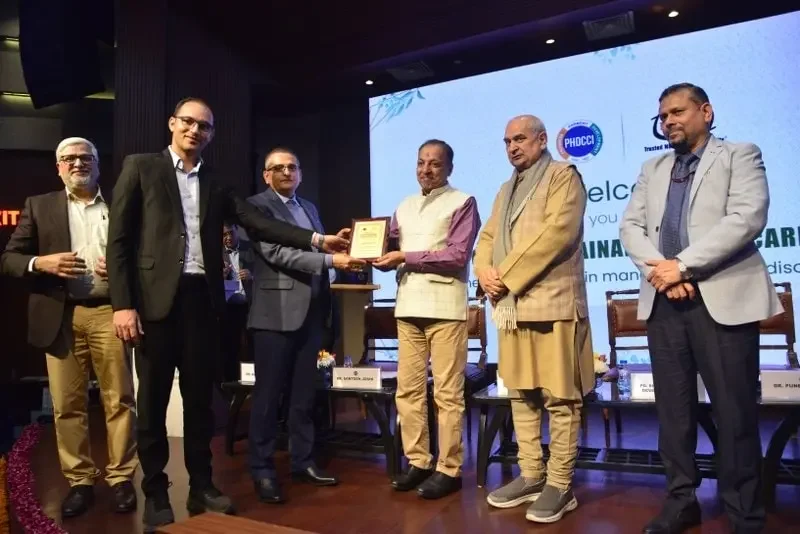 Karma ayurveda's founder: Dr Puneet Dhawan receiving award's from 
